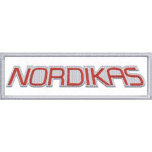 Patch ricamato su base bianca  cm.8 x 2,5 scritta "NORDIKAS"