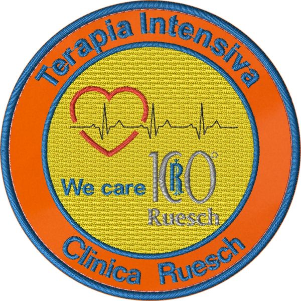 Patch ricamato base arancio e filo giallo Terapia Intensiva CLINICA RUESCH  SU BASE ZIGZAG ARANCIO
