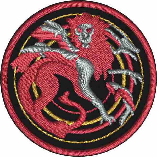 Patch ricamata chimera su base nera diam. cm.5 con filato poliestere 