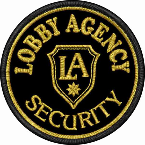 Patch ricamato su base nera Logo LOBBY AGENCY  (SECURITY) cm. 8 di diametro 