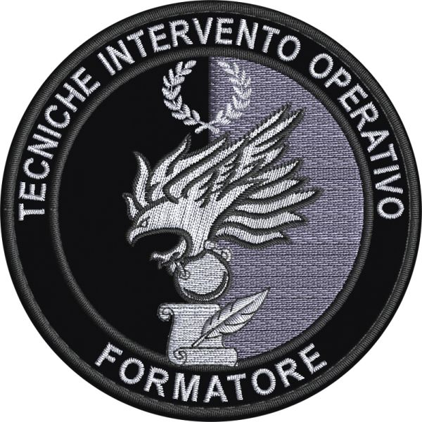 Patch ricamato (FORMATORE TECNICHE INTERVENTO OPERATIVO) Su base nera  diam. cm. 9 